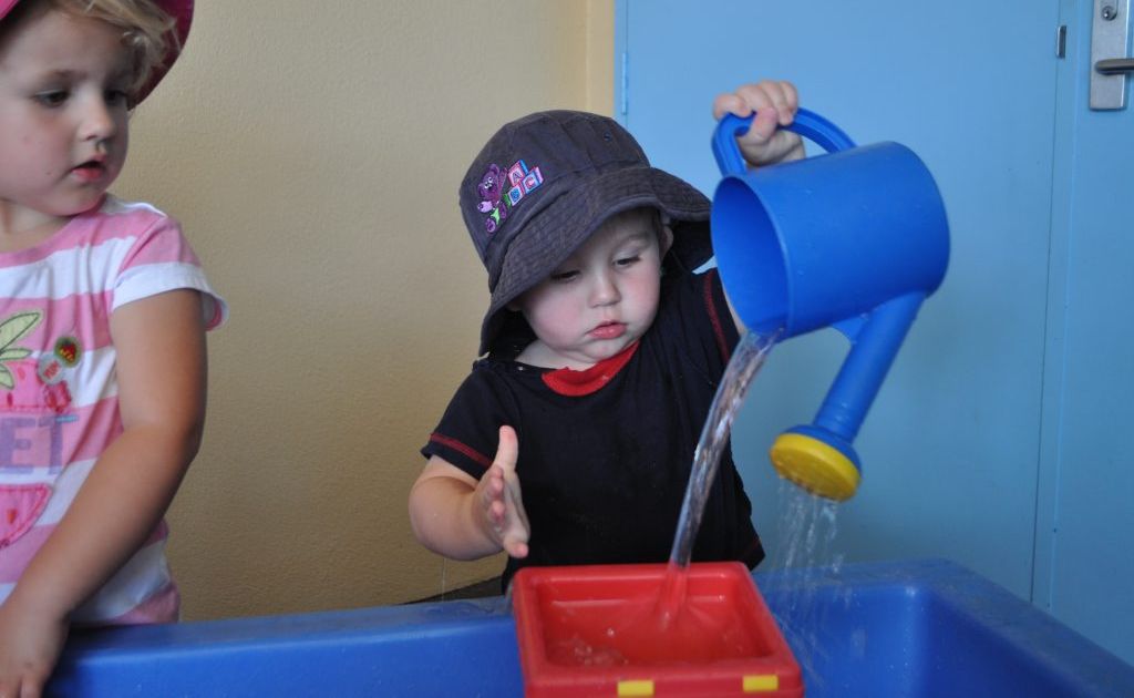 Hunter Forbes splashes in the water to keep cool. 